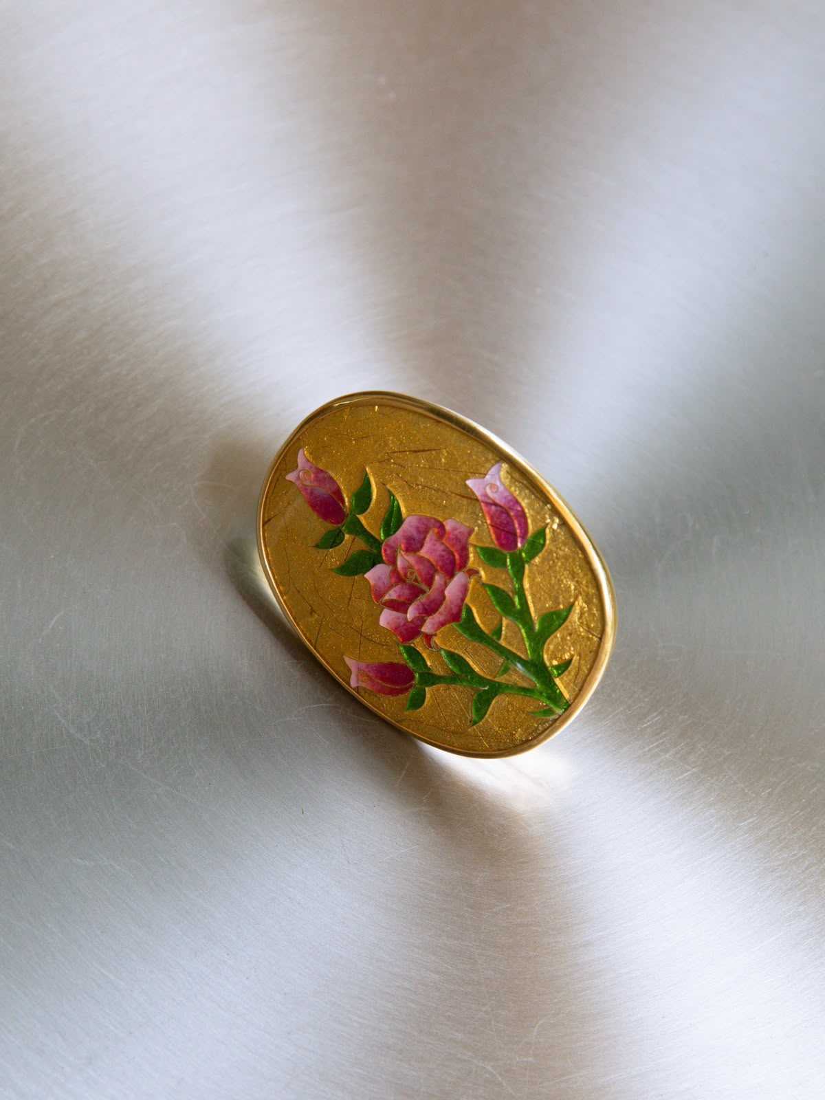 Big golden round ring with roses