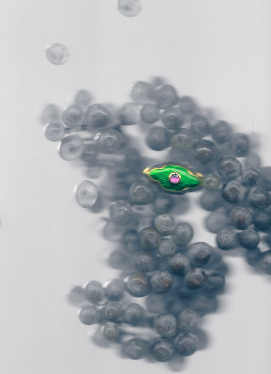 GREEN RING WITH A PINK STONE