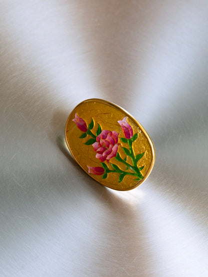 Big golden round ring with roses