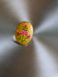 Big golden round ring with roses