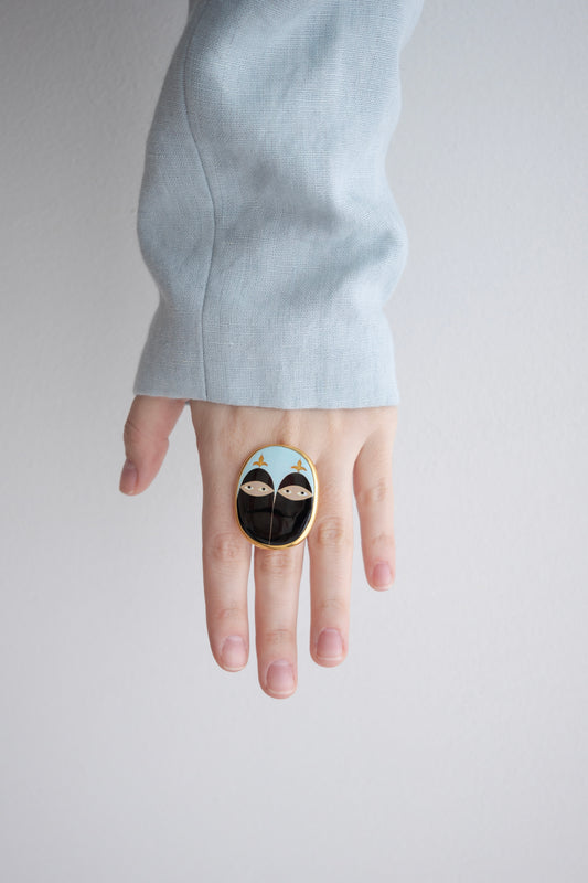 RING WITH TWO FACES